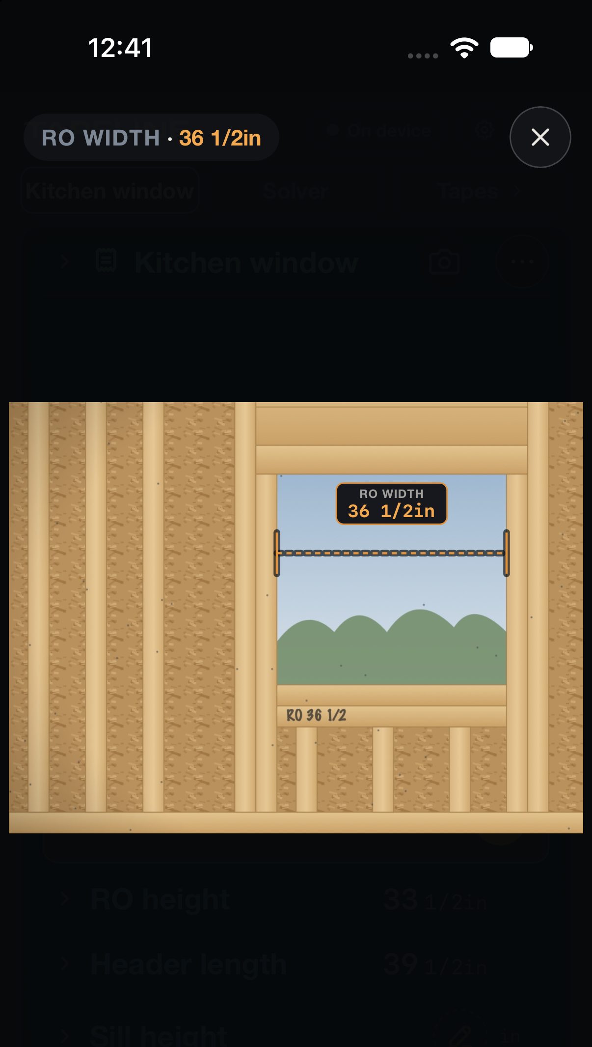 A photo of a framed window opening with the RO width dimension, 36 1/2 inches, drawn between the jambs.